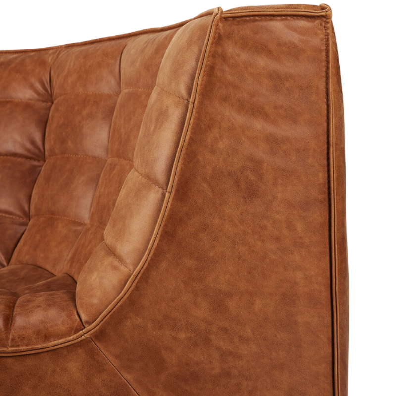 The N701 Round Leather Corner from Ethnicraft focusing on the backrest.