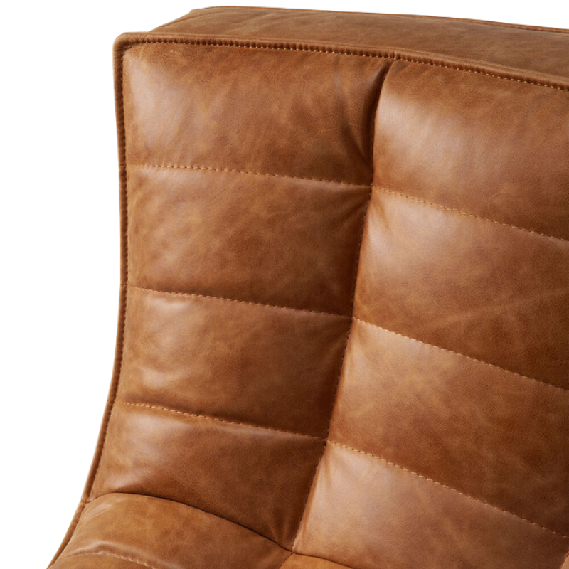 The N701 Round Leather Corner from Ethnicraft highlighting the aniline leather upholstery.