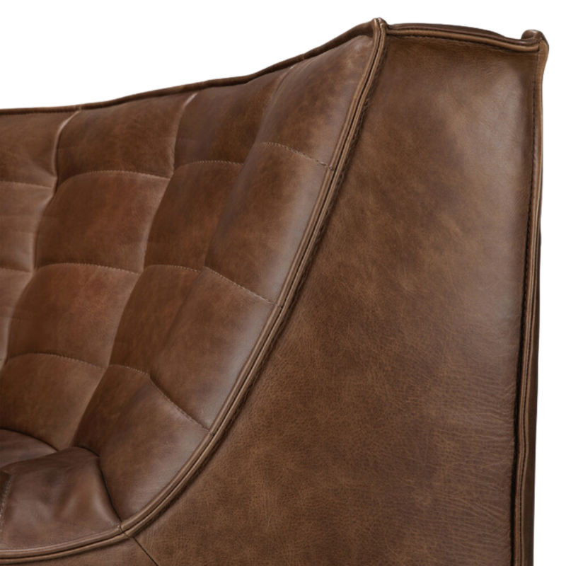 The N701 Round Leather Footstool from Ethnicraft with a close-up of the backrest.