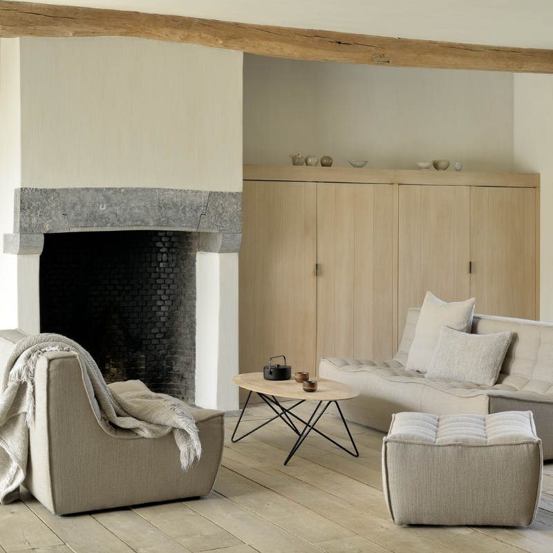 The N701 Two Seater Sofa from Ethnicraft with beige standard fabric in a family room.