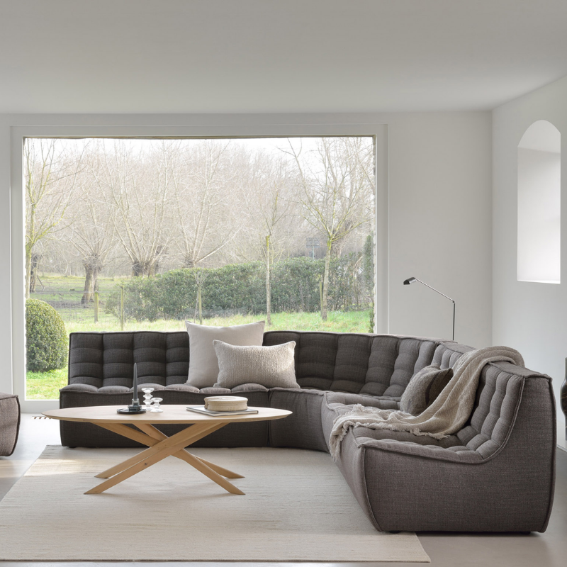The N701 Two Seater Sofa from Ethnicraft with dark grey standard fabric in a designer home.