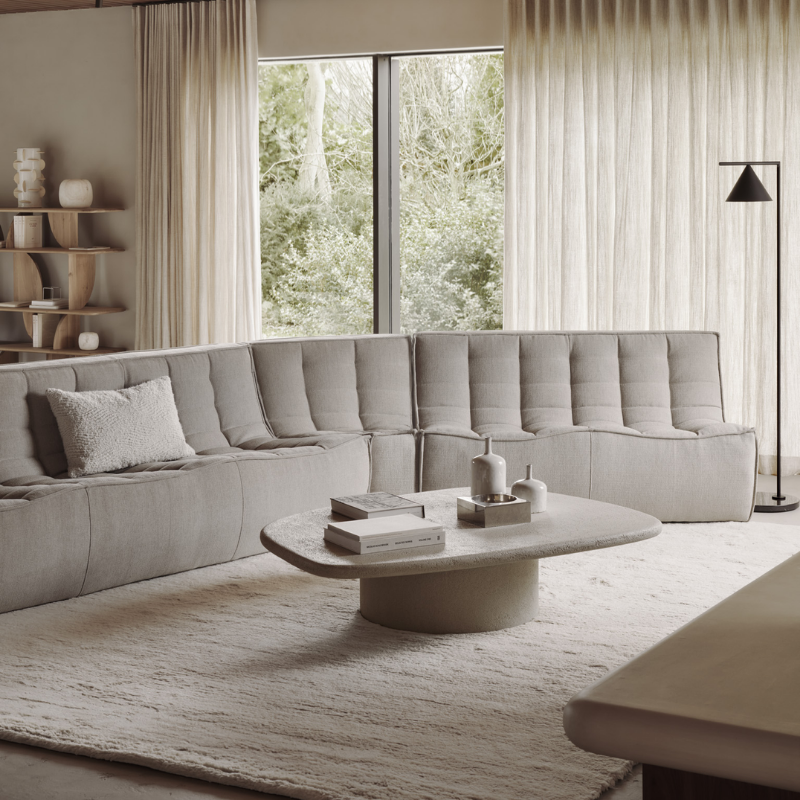 The N701 Two Seater Sofa from Ethnicraft with ecru eco fabric in a family space.