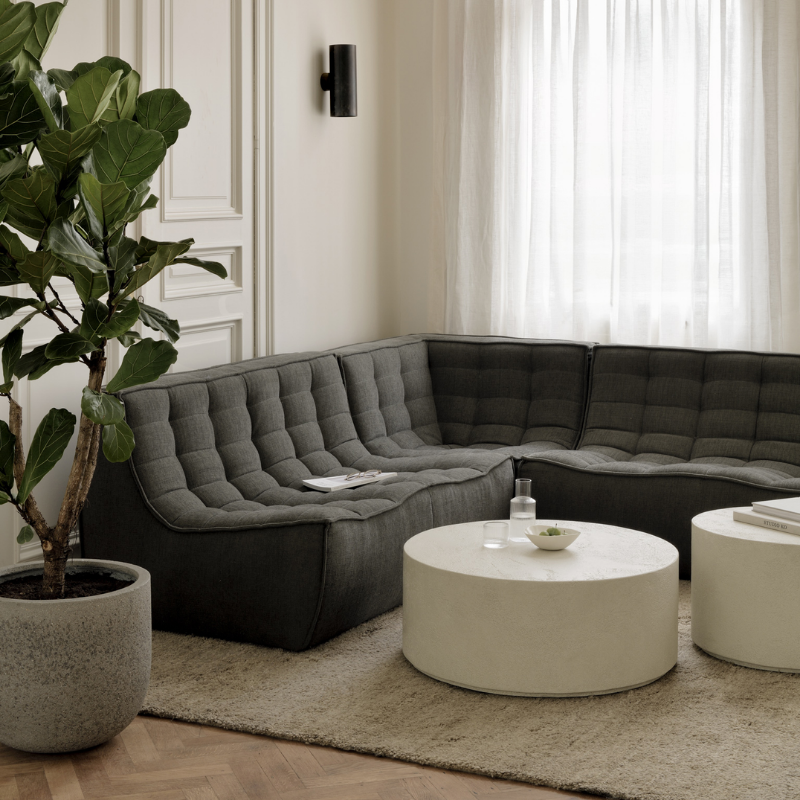 The N701 Two Seater Sofa from Ethnicraft with moss eco fabric in a family room.