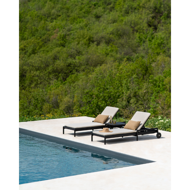 The cumin Nomad Rectangular Outdoor Cushion by Ethnicraft poolside.