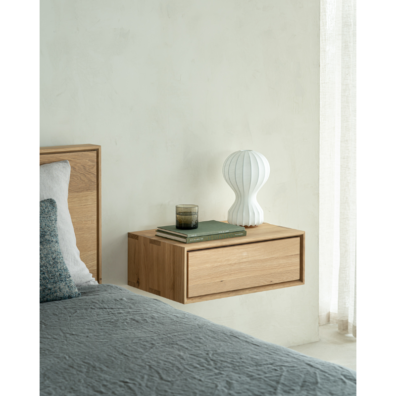 The Nordic II Hanging Bedside Table from Ethnicraft in a guest bedroom.