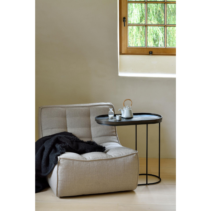 The oblong Tray Side Table from Ethnicraft in a living room.