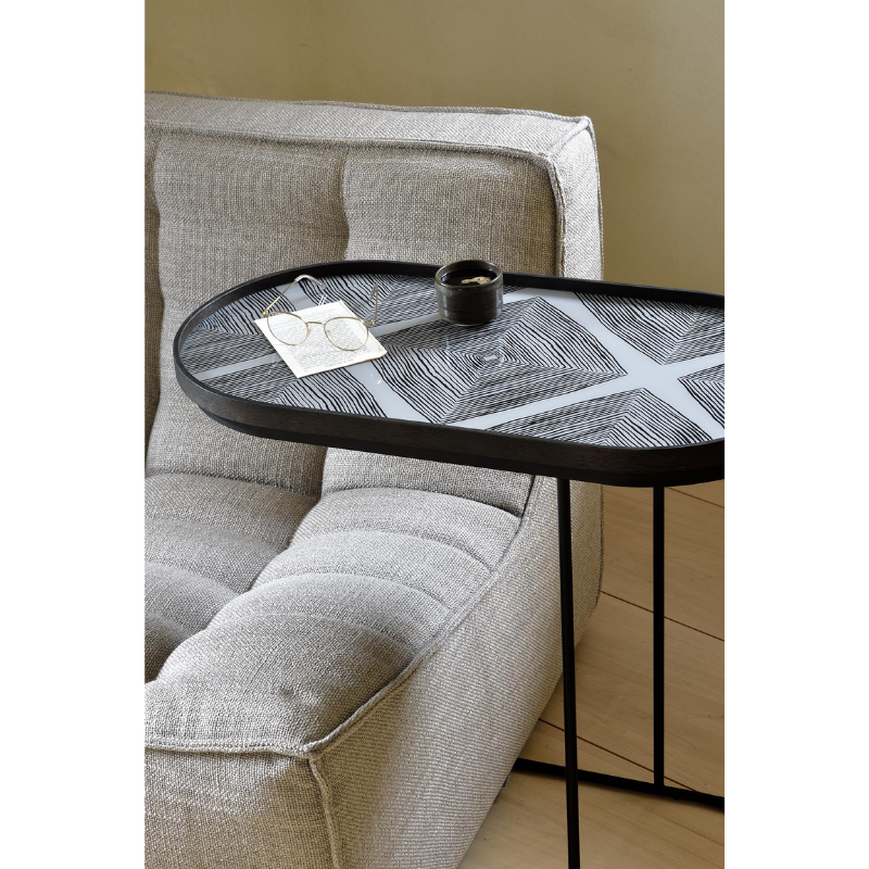The oblong Tray Side Table from Ethnicraft in a lounge.