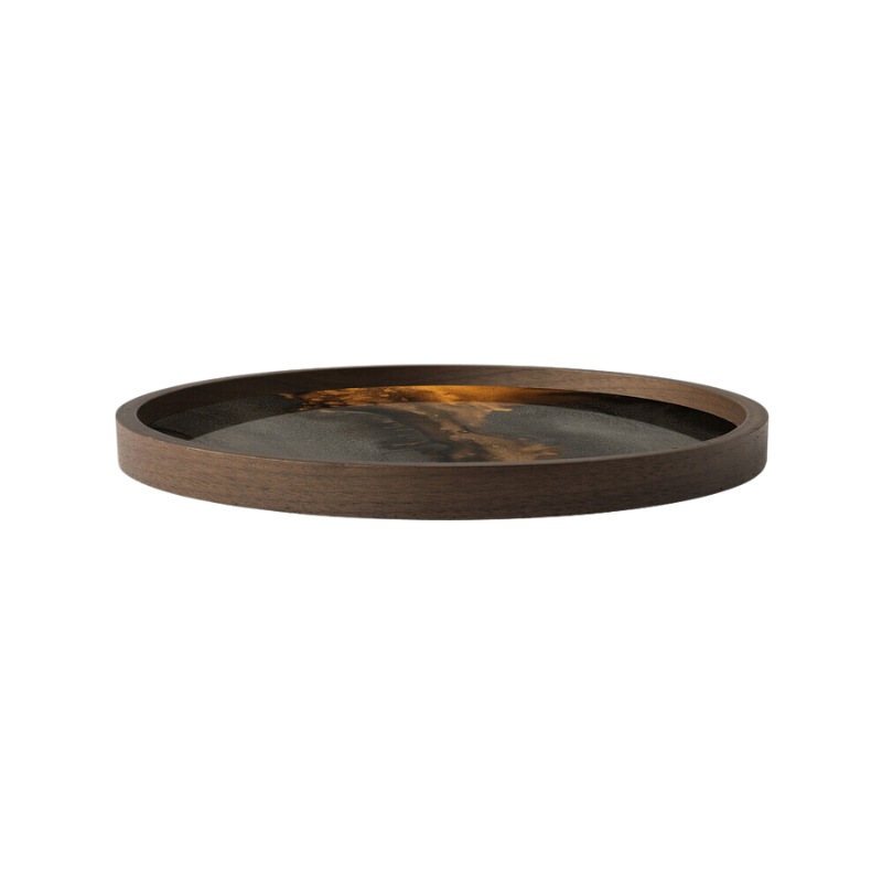 The round Organic Valet Tray from Ethnicraft in bronze from the side.