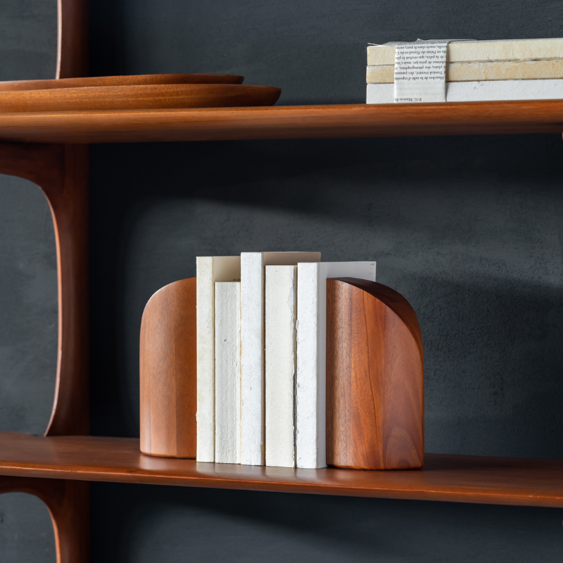 PI Book Ends in mahogany wood on the PI wall shelf.