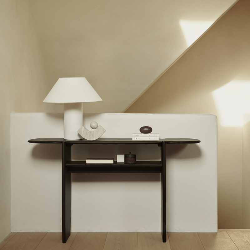 The PI Console from Ethnicraft in dark brown mahogany in a hallway.