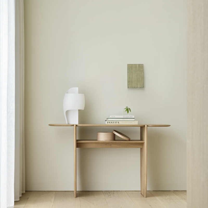 The PI Console from Ethnicraft in oak in a bedroom.