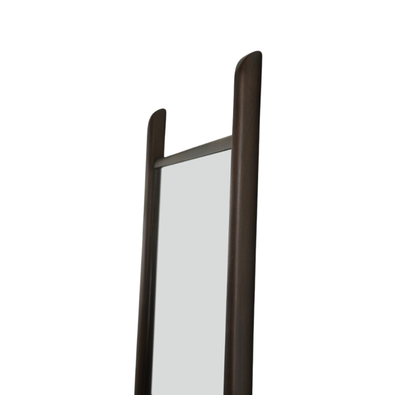 The slim PI Floor Mirror from Ethnicraft in a photograph focusing on the top of the mirror.