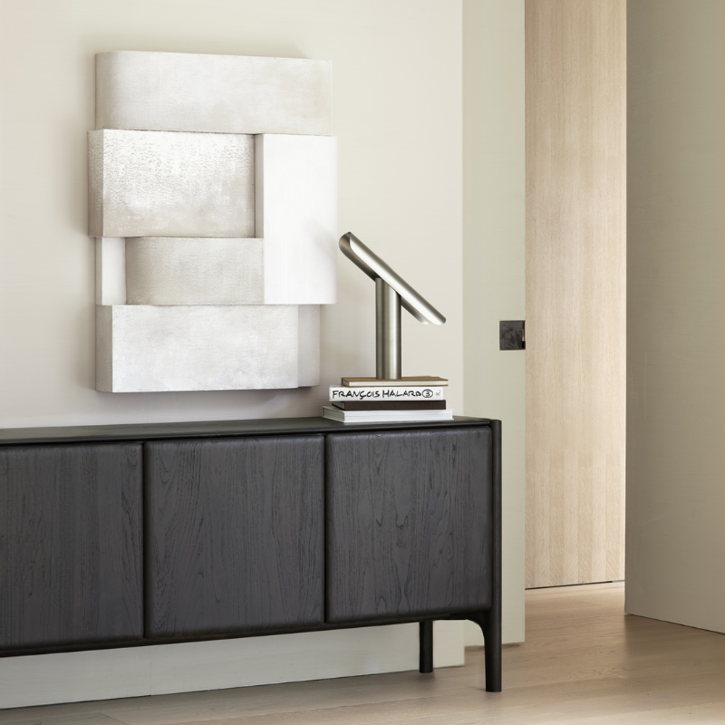 The PI Sideboard from Ethnicraft in dark brown teak in a living space.