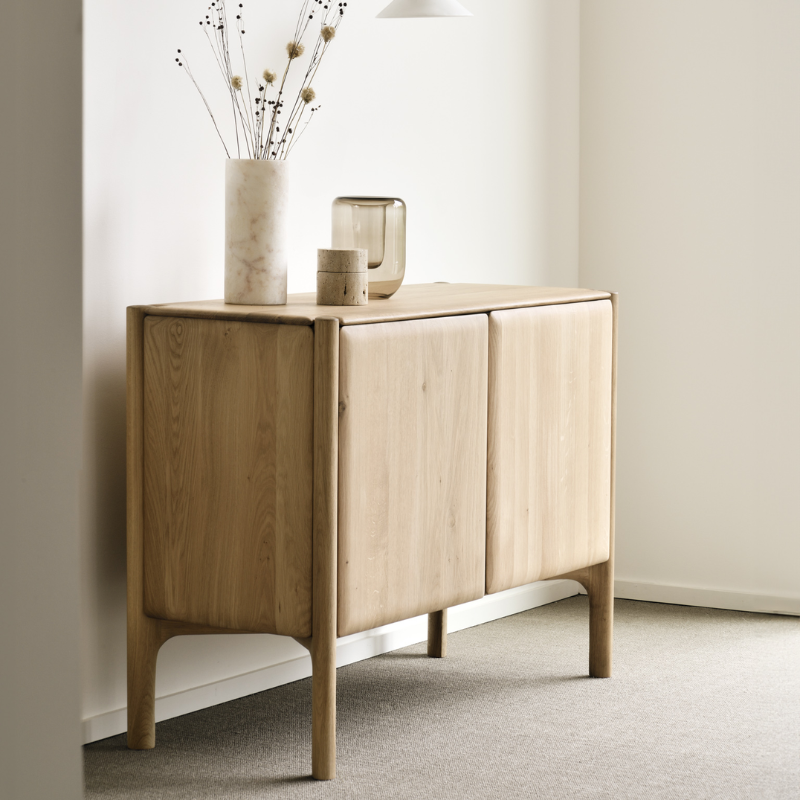 The PI Sideboard from Ethnicraft in oak in a family area.