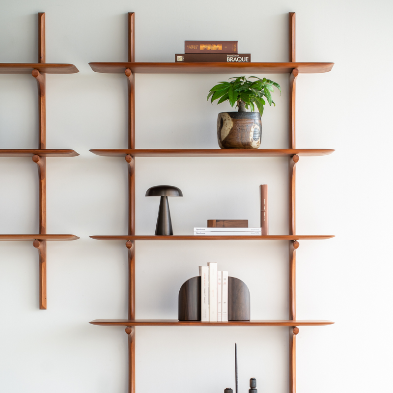 The PI Wall Shelf with Five Shelves from Ethnicraft in a lounge.