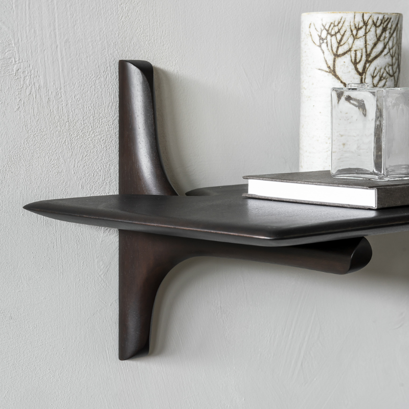 The PI Wall Shelf from Ethnicraft in a living space.