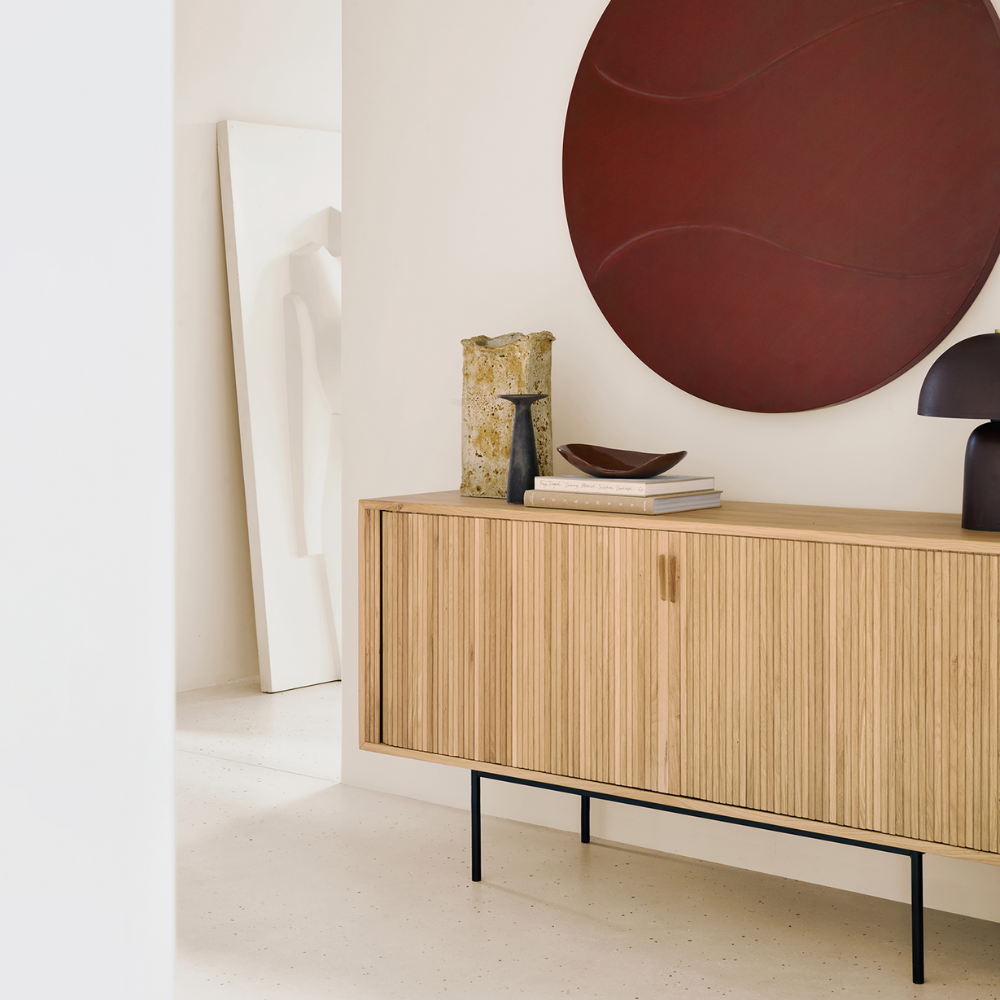 The 66-inch Roller Max Sideboard from Ethnicraft in oak in a living room.