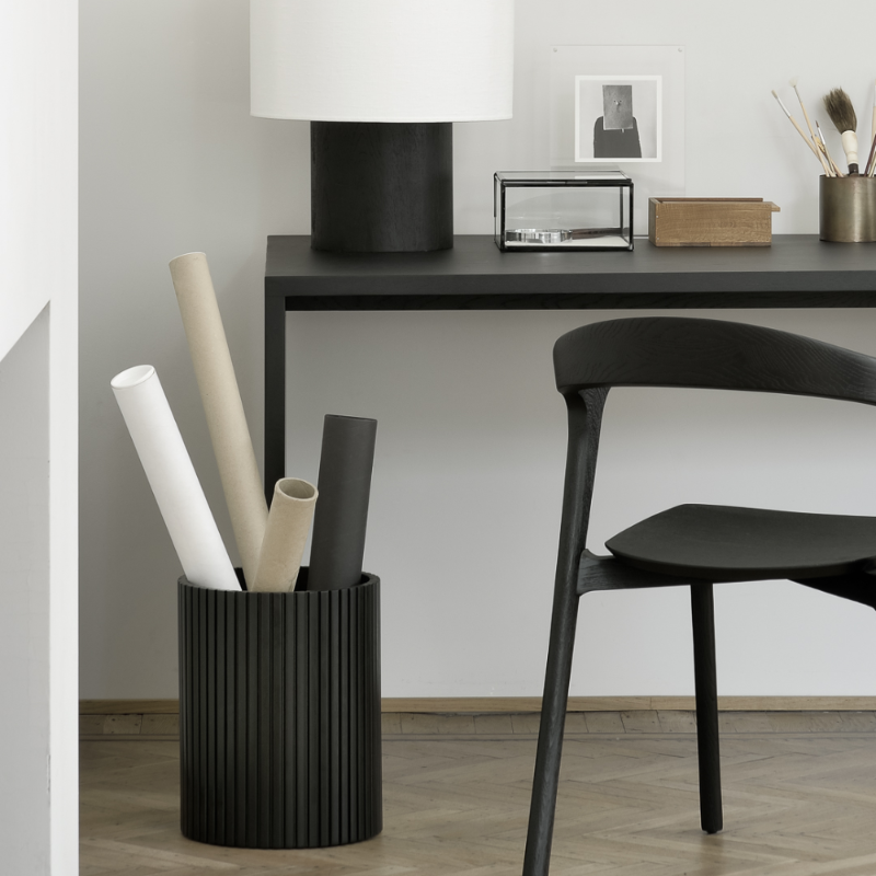 The Roller Max Paper Basket from Ethnicraft in a study room.