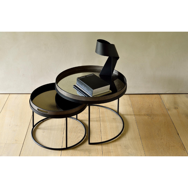 The bronze Aged Mirror Tray from Ethnicraft in a home office.