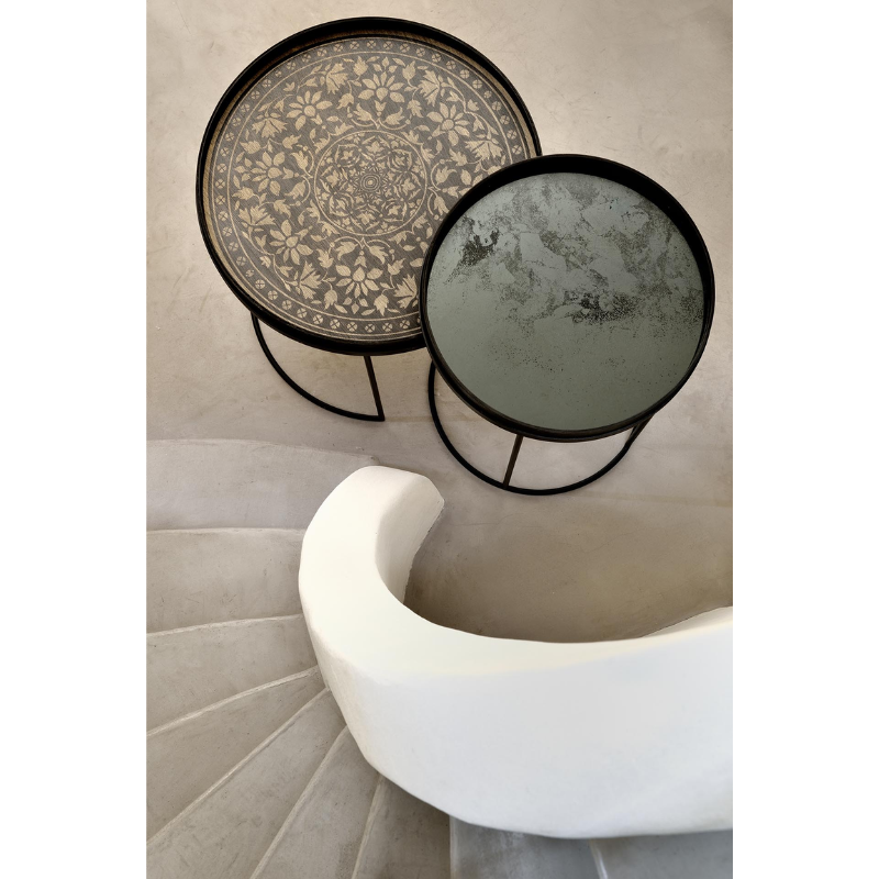 The clear Aged Mirror Tray from Ethnicraft in a family space.