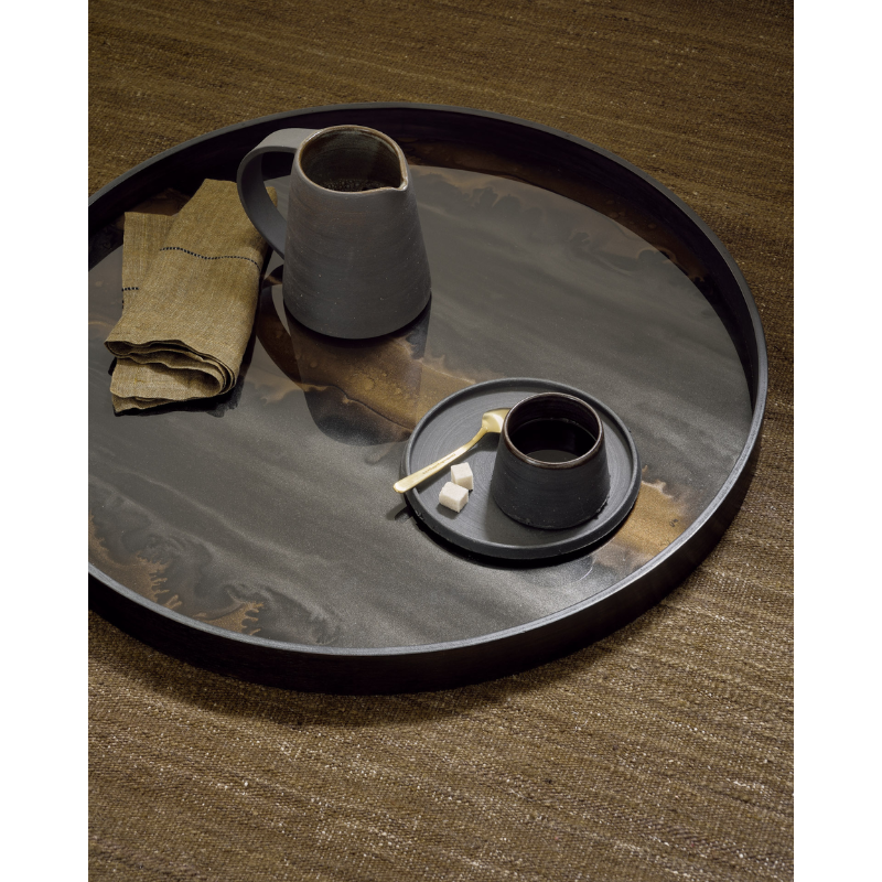 The medium bronze round Organic Glass Tray from Ethnicraft used as a serving tray.