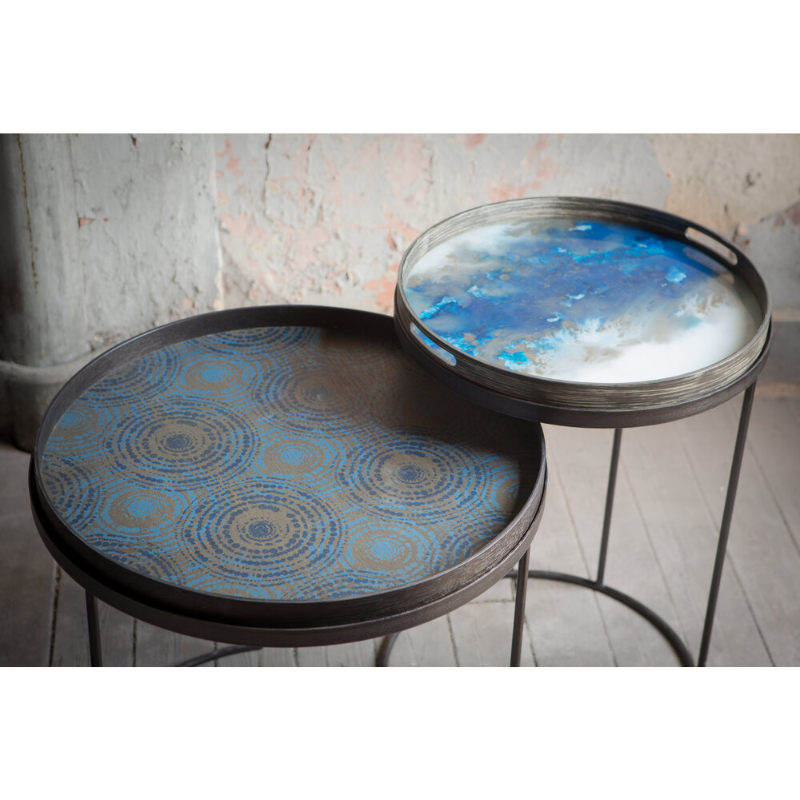 The round blue mist Organic Glass Tray from Ethnicraft in a home.