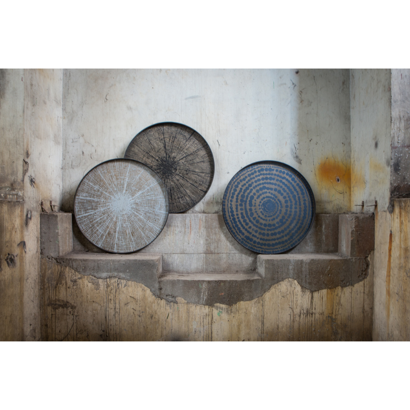 The large black and white round Slice Wooden Tray from Ethnicraft variety of wooden trays.