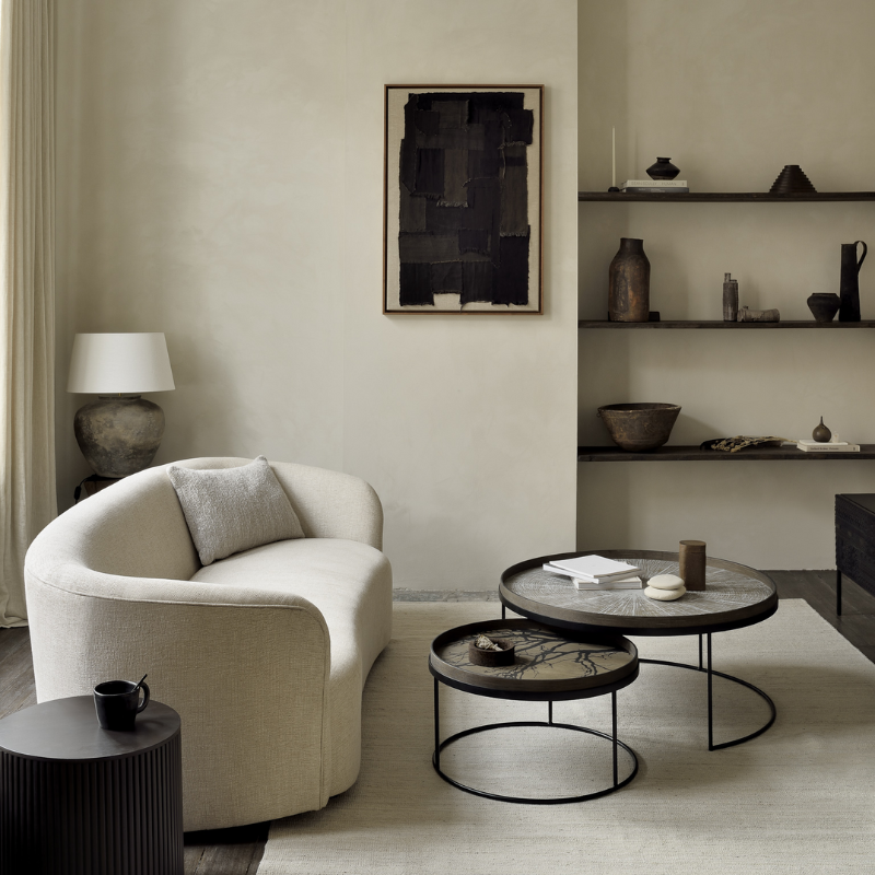 The medium and large Round Tray Coffee Table Set from Ethnicraft in a family area.