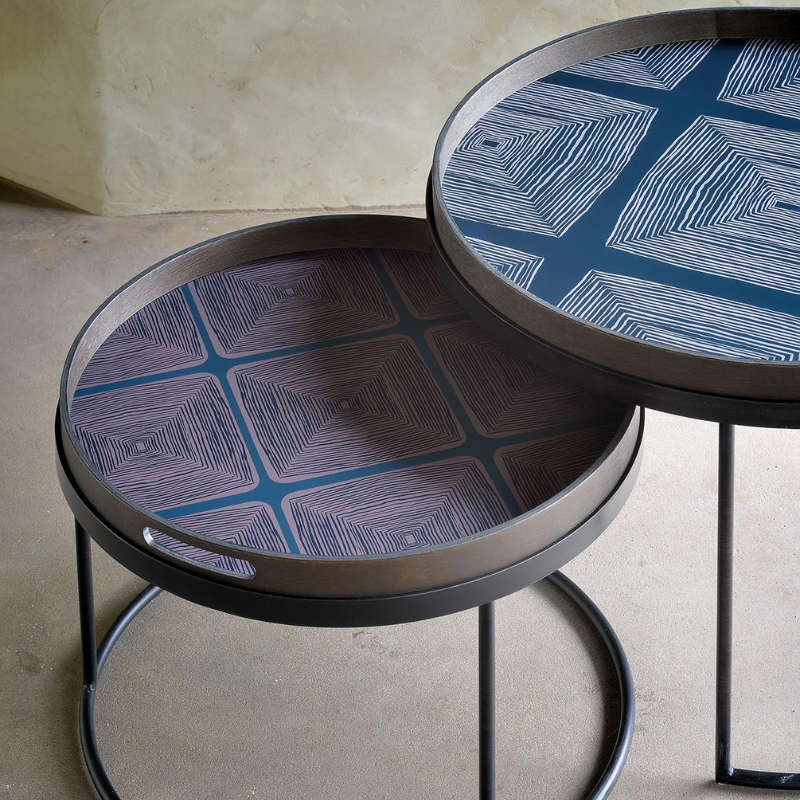 The small and medium Round Tray Coffee Table Set from Ethnicraft in a living room.