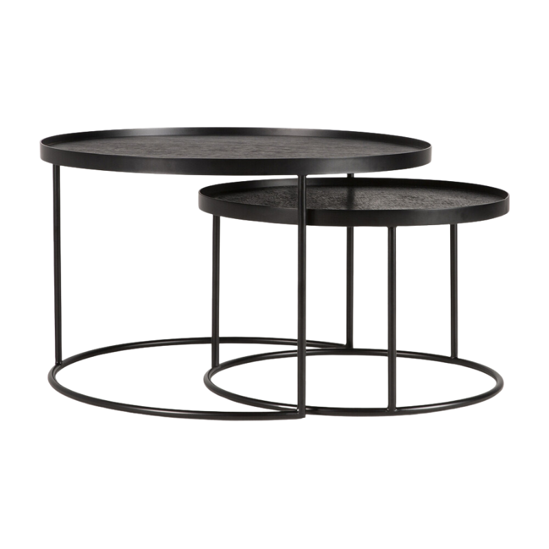 The small and medium Round Tray Coffee Table Set from Ethnicraft used as nesting tables to save space.