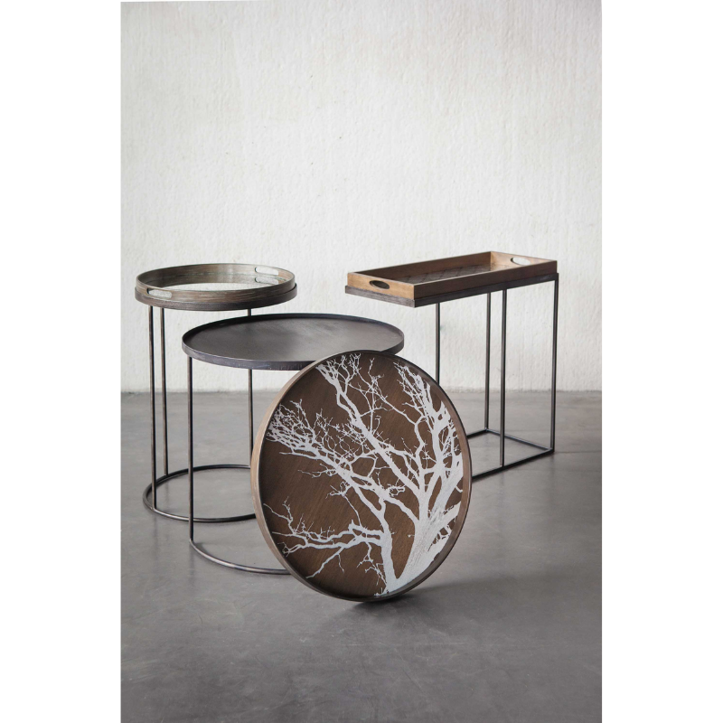 The white Tree Wooden Tray from Ethnicraft with a variety of other trays.