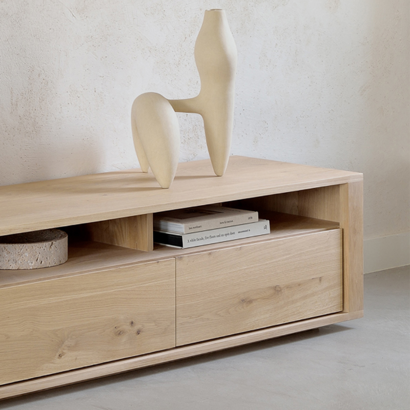 The Shadow TV Cupboard from Ethnicraft in a living room.