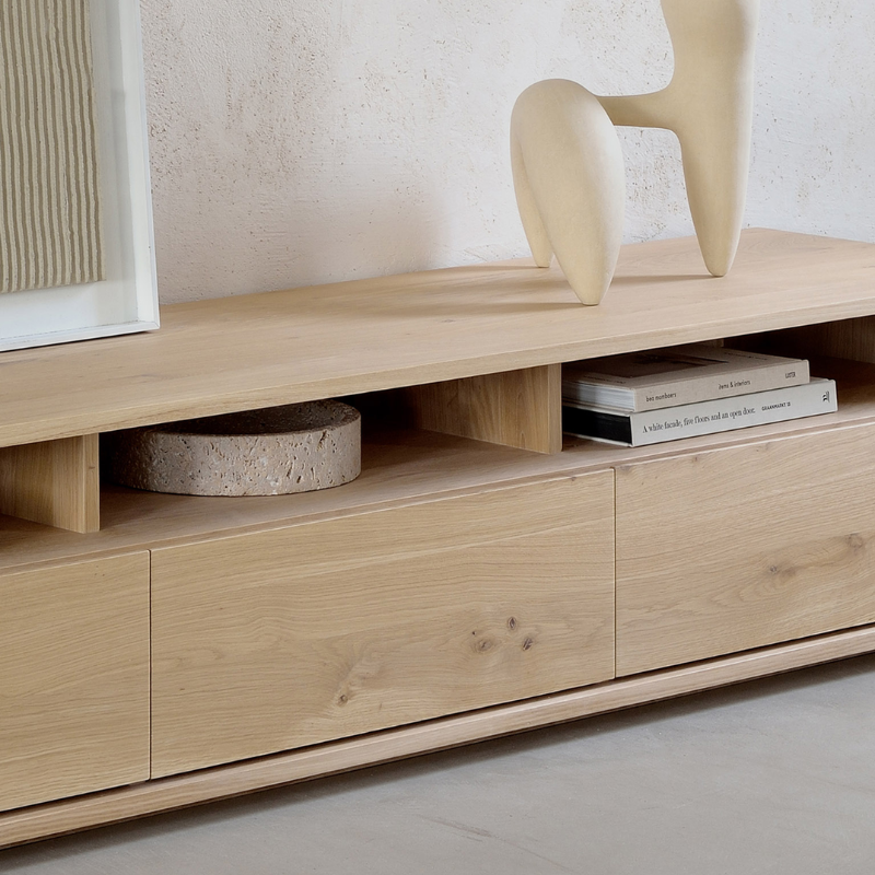 The Shadow TV Cupboard from Ethnicraft in a lounge.