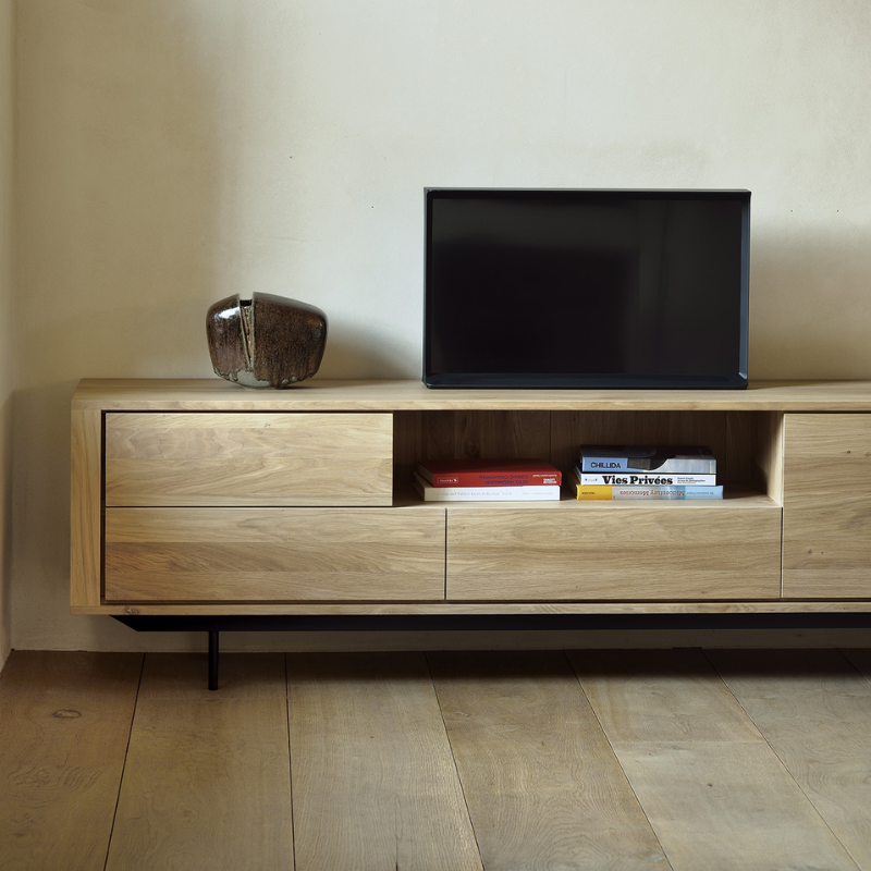 The Shadow TV Stand from Ethnicraft in a living room.