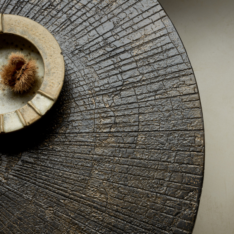 The 41.5 inch Slice Coffee Table from Ethnicraft in a family area.