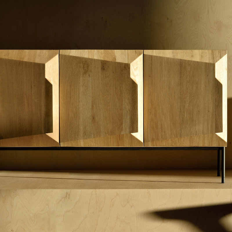 The Stairs Sideboard from Ethnicraft in a living room.