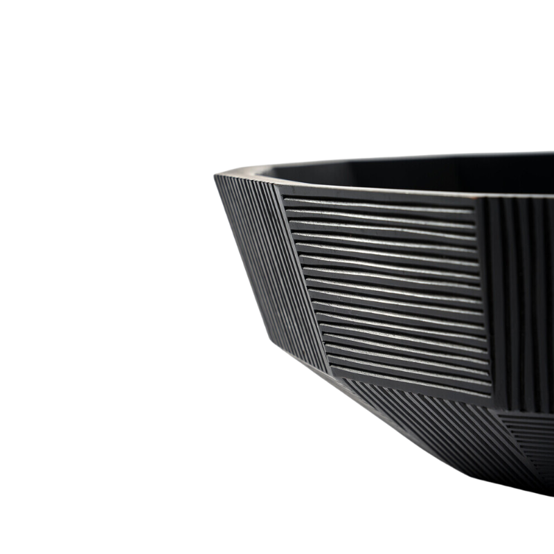 The Striped Bowl from Ethnicraft in a close up.