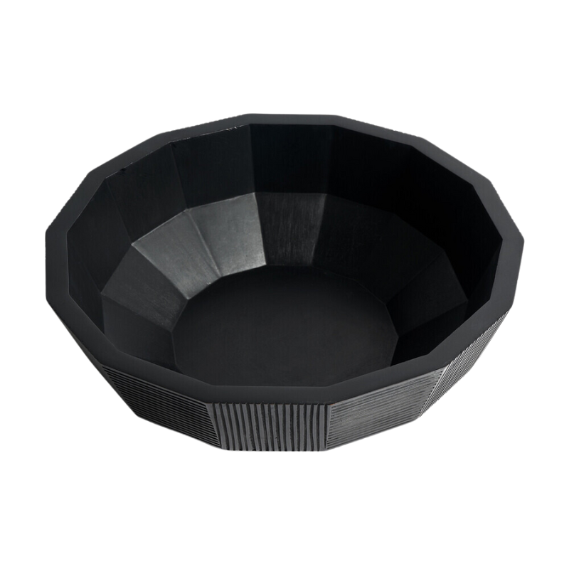 The Striped Bowl from Ethnicraft in a studio.