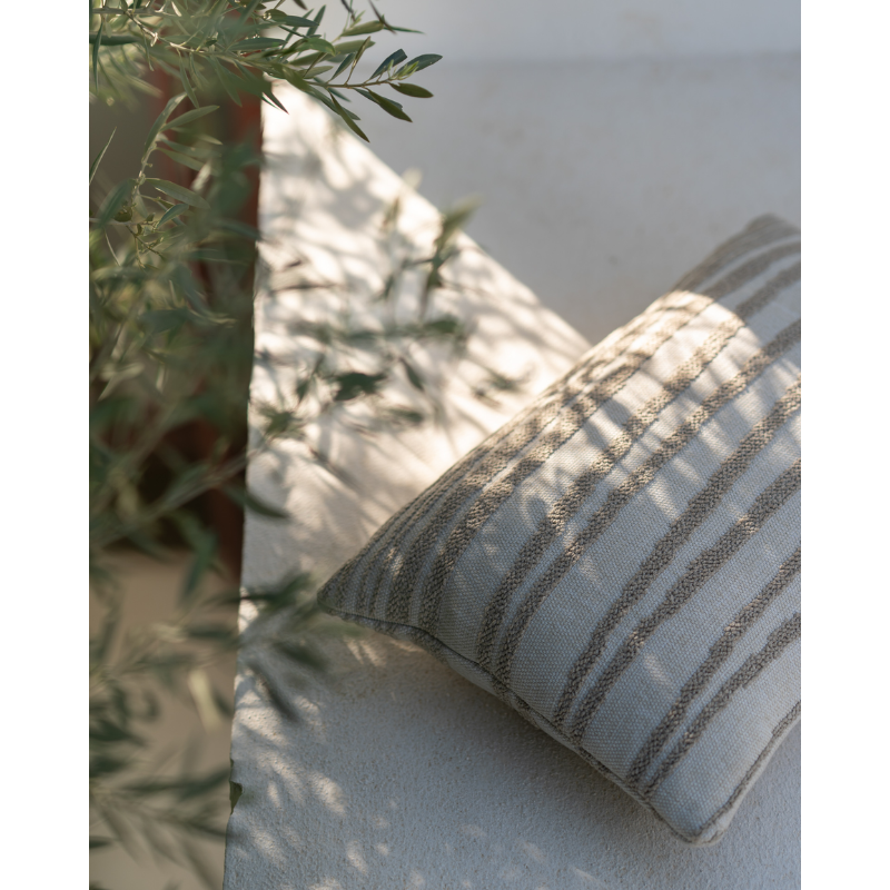 The Stripes Outdoor Cushion from Ethnicraft in an outdoor living space.