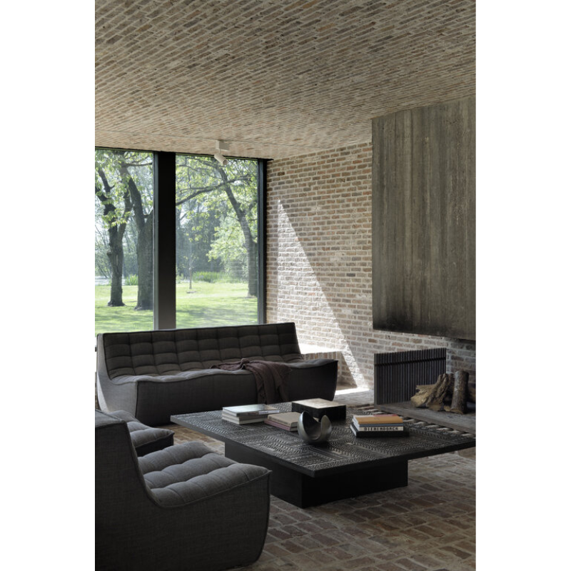 The Tabwa Coffee Table from Ethnicraft in a lounge.