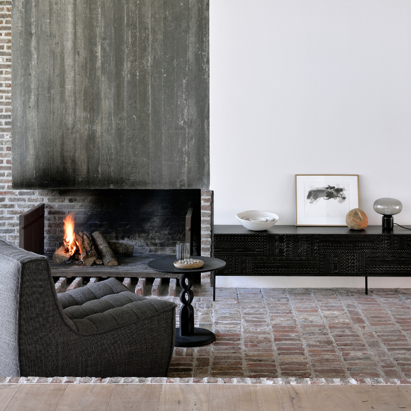 The Tabwa TV Cupboard from Ethnicraft in a living room.