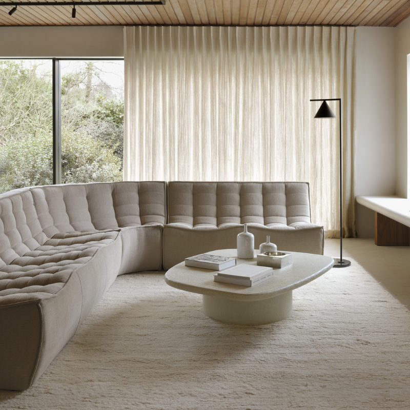 The N701 Three Seater Sofa from Ethnicraft with ecru eco fabric in a living room.