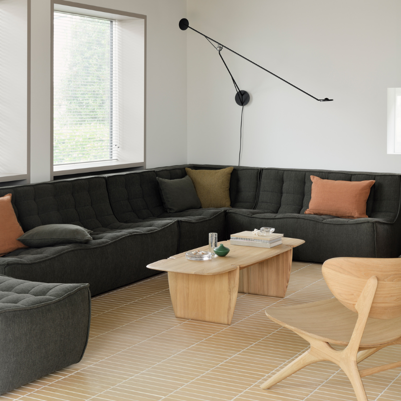 The N701 Three Seater Sofa from Ethnicraft with moss eco fabric in a living room.