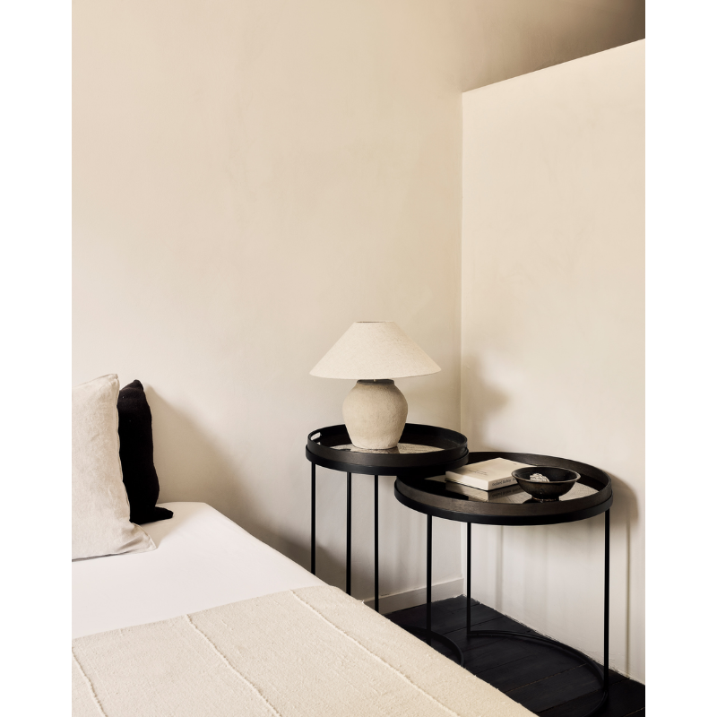 The Tray Side Table Set from Ethnicraft in a primary bedroom.