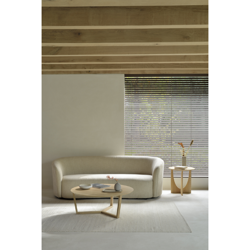 The Tripod Coffee Table from Ethnicraft in a living room.