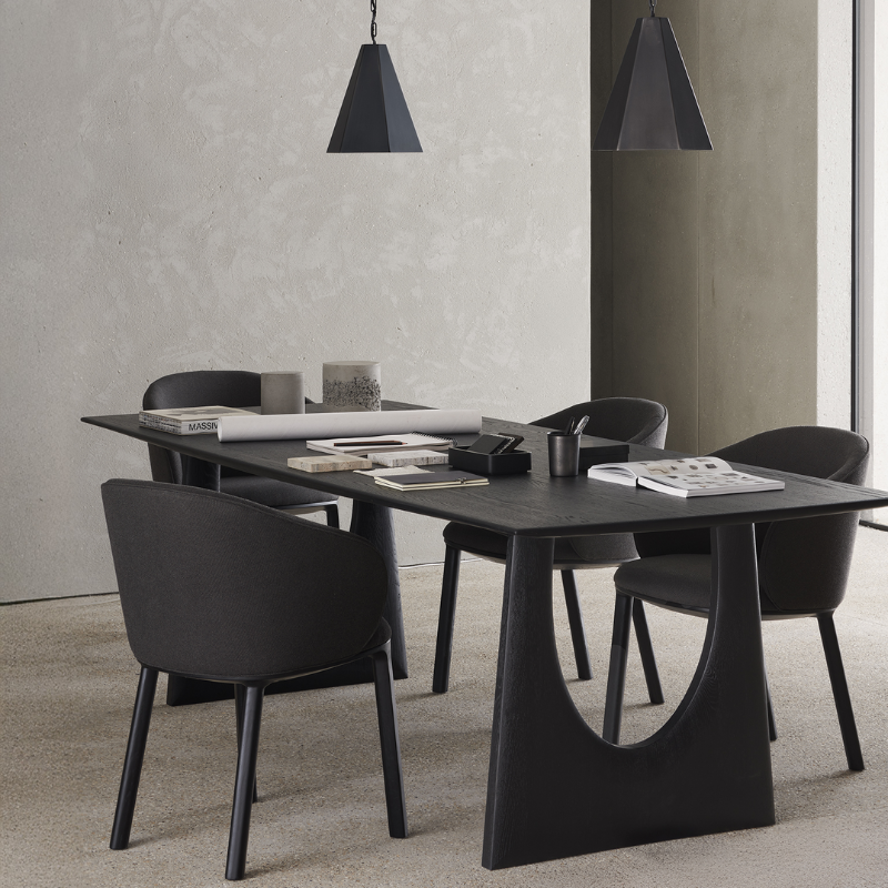 The Unda Dining Chair from Ethnicraft in black in a dining room.