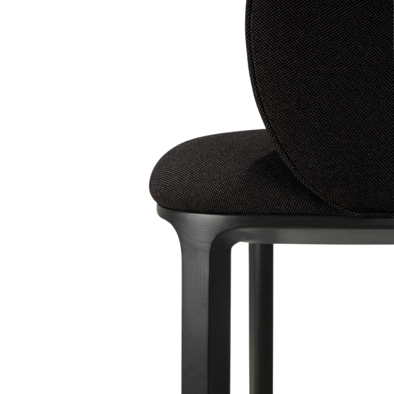 The Unda Dining Chair from Ethnicraft in black focusing on the legs.