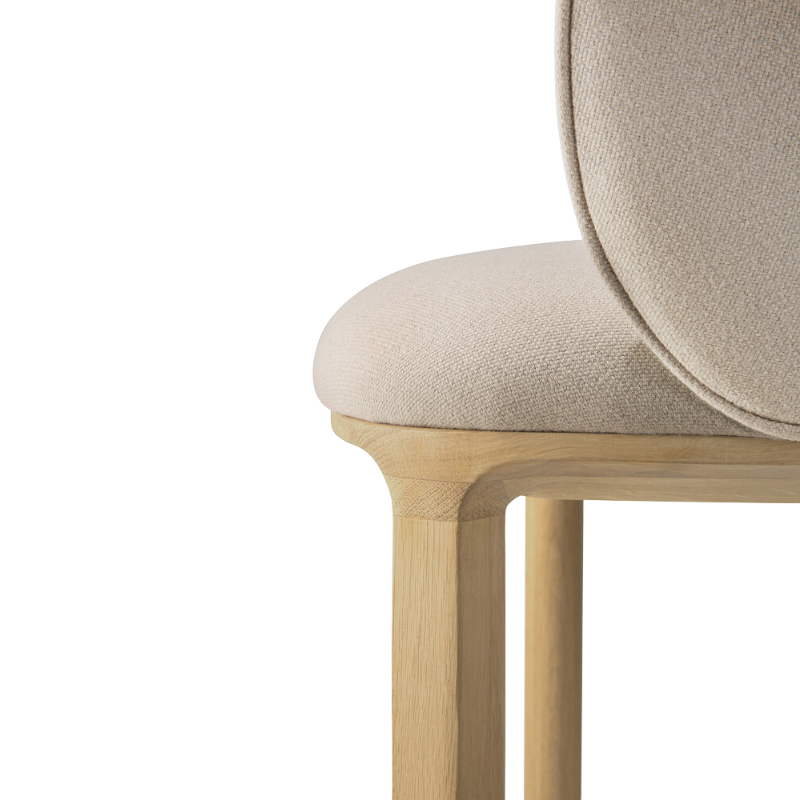 The Unda Dining Chair from Ethnicraft in salt focusing on the legs.