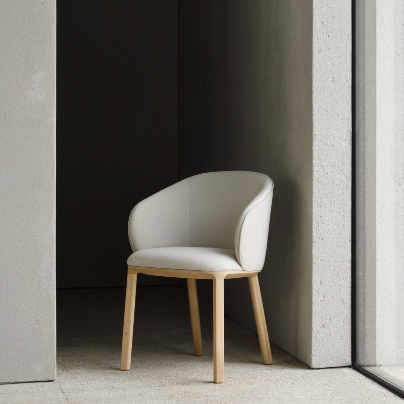 The Unda Dining Chair from Ethnicraft in salt in a living room.