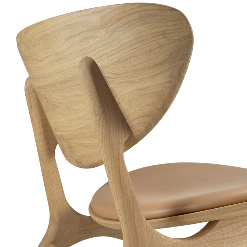 The Upholstered Eye Lounge Leather Chair by Ethnicraft from backrest close-up.